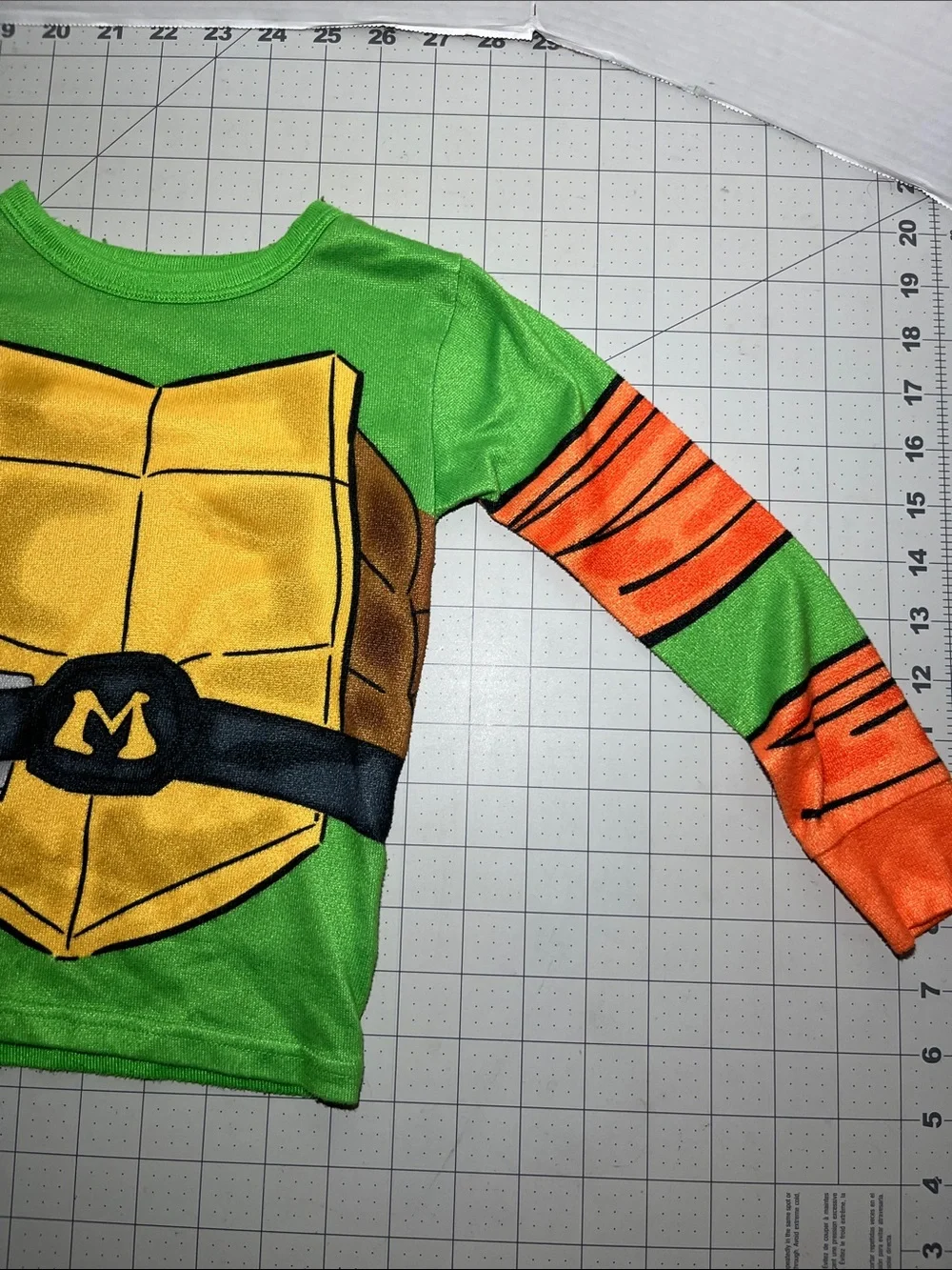 Kids Green Turtle Shell Pajama Top with Orange Sleeve Accents